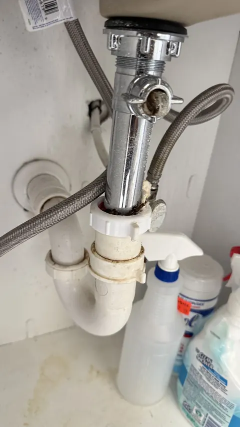 Old leaking sink drain assembly before replacement, Orlando FL drain cleaning