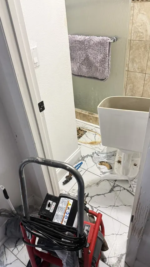 Toilet removed to access clogged drain line, Orlando FL drain cleaning