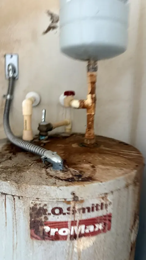 Old corroded water heater before replacement, Orlando FL