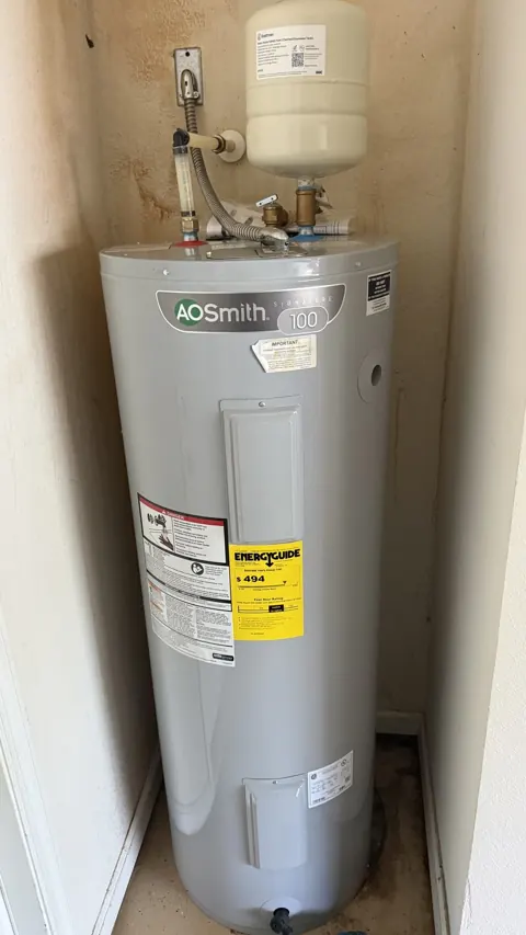 Close-up of new water heater fittings and expansion tank, Orlando FL